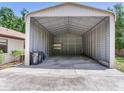 Spacious metal storage building next to house and garage at 2217 High Point Dr, Brandon, FL 33511