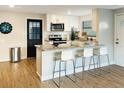 Eat-in kitchen with breakfast bar, granite countertops and stainless steel appliances at 2606 E 97Th Ave, Tampa, FL 33612