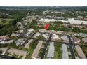An aerial view showcases the property's location in a residential community at 4039 La Pasida Ln, New Port Richey, FL 34655