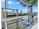 View of a private boat lift on the canal for easy access to boating and water activities at 6530 Simone Shores Cir, Apollo Beach, FL 33572