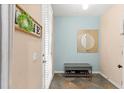 Bright entryway featuring tile floors, fresh paint, coat rack, and a stylish round mirror at 918 Sombra Street, Tampa, FL 33619