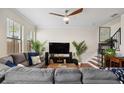 Inviting living area with hardwood floors, neutral tones, and an open concept layout at 109 S Packwood Ave # B, Tampa, FL 33606