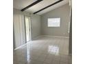 Bright and airy living space with vaulted ceilings and sliding door access at 116 Cranbrooke Dr, Seffner, FL 33584