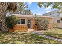Charming single-story home featuring a stone pathway, manicured lawn, and inviting front porch at 131 44Th N Ave, St Petersburg, FL 33703