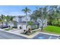 Charming townhome with a two-car garage, a lawn, and handicap parking at 18148 Nassau Point Dr, Tampa, FL 33647