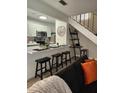 Modern kitchen with stainless steel appliances, stylish breakfast bar, and contemporary decor at 1833 Bough Ave # 2, Clearwater, FL 33760
