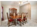 Traditional dining room featuring a wooden table with seating for six and a classic china cabinet at 18967 Wood Sage Dr, Tampa, FL 33647