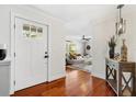 Welcoming entryway featuring hardwood floors and a view into the cozy living room at 1960 Sever Dr, Clearwater, FL 33764