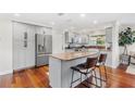 Modern kitchen with stainless steel appliances and granite countertops, plus an island and seating at 1960 Sever Dr, Clearwater, FL 33764