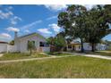 Pleasant home with a well-maintained lawn, mature trees, and a serene neighborhood setting at 2627 17Th N Ave, St Petersburg, FL 33713