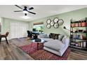 Cozy living room with stylish decor, wood flooring, and a comfortable seating area at 3229 40Th S Ln # C, St Petersburg, FL 33711