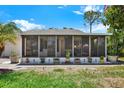 Enclosed sunroom featuring a wall of screened windows, perfect for outdoor living at 3229 40Th S Ln # C, St Petersburg, FL 33711