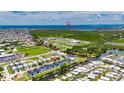 Aerial view of waterfront community highlighting canal access, nearby Intracoastal Waterway, and proximity to open water at 6532 Simone Shores Cir, Apollo Beach, FL 33572
