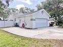 View of the side of the house and the two-car garage at 9191 64Th N Way, Pinellas Park, FL 33782