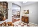 Elegant foyer with decorative flooring, arched doorways, and a view into the dining room at 10709 Rockledge View Dr, Riverview, FL 33579