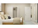 Cozy bedroom boasts a bed with soft bedding, closet, and a mirror for getting ready at 11083 E 65Th Ter, Palmetto, FL 34221