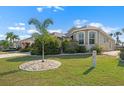 Attractive single-story home with a beautiful front lawn and mature landscaping at 1110 Jasmine Creek Ct, Sun City Center, FL 33573