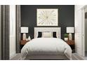 Beautifully staged bedroom featuring a plush bed, stylish decor, and ample natural light at 12597 Lily Quartz Loop, Parrish, FL 34219
