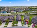 Aerial view of a beautiful home surrounded by a lush landscape in a serene neighborhood at 1321 Custer Bayou St, Ruskin, FL 33570