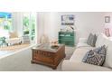 Cozy living room with comfortable seating, stylish decor, and ample natural light at 14840 Shipwatch Trce # 1924, Largo, FL 33774