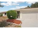 Charming single-story home featuring a well-manicured front yard and attached garage, creating a welcoming curb appeal at 1521 Fireside St, Port Charlotte, FL 33952