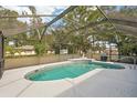 Enjoy the Florida lifestyle in this home with a screened-in pool and patio area at 1521 Fireside St, Port Charlotte, FL 33952