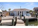 Waterfront home with large wooden deck, boat dock with direct access to the Gulf of Mexico at 253 Boca Ciega Dr, Madeira Beach, FL 33708