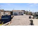 Waterfront home with large wooden deck for entertaining with boat dock access to the Gulf at 253 Boca Ciega Dr, Madeira Beach, FL 33708