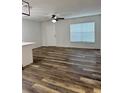 Bright living room featuring modern flooring and a ceiling fan for comfortable living at 2690 Coral Landings Blvd # 217, Palm Harbor, FL 34684