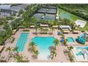 Aerial view of community pool with lap lanes, pool, tennis courts, and basketball court at 30764 Lindentree Dr, Wesley Chapel, FL 33543