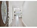 Inviting foyer with elegant details, flowing into a spacious living area with stunning views at 6119 Galleon Way, Tampa, FL 33615
