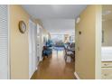 Bright condo entryway flowing into living space with views, hardwood floors, and coastal décor at 6265 Sun Blvd # 605, St Petersburg, FL 33715