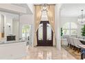 View of the foyer showcasing the front door and an open floorplan at 703 Monte Cristo Blvd, Tierra Verde, FL 33715