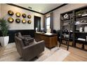 Stylish office with a textured wall, comfortable seating, and black trim throughout at 4111 W Swann Ave, Tampa, FL 33609