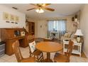 Cozy living space with a charming mix of furniture, a ceiling fan, and natural light at 10031 Cherry Creek Ln, Port Richey, FL 34668