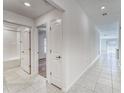 Bright hallway with ceramic tile leading to bedrooms and living areas at 10245 Shady Preserve Dr, Riverview, FL 33578