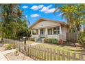Attractive single-story home boasting a well-kept lawn and a classic picket fence at 1530 21St N Ave, St Petersburg, FL 33704