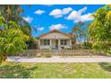 Inviting single-story home featuring a well-maintained front yard with lush landscaping and a sidewalk at 1530 21St N Ave, St Petersburg, FL 33704