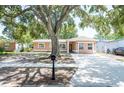 Charming single-story home with a large front yard and spacious driveway at 2121 23Rd Sw St, Largo, FL 33774