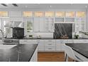 Spacious kitchen featuring stainless steel appliances, marble backsplash and countertop, and modern cabinetry at 2603 Sanders Dr, Tampa, FL 33611