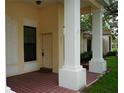 Charming front entrance with brick flooring and covered porch at 311 Kelsey Way # 3, Sun City Center, FL 33573