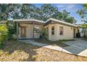 Charming one-story home with a covered porch, providing a welcoming entrance at 4412 Bray Rd, Tampa, FL 33634