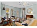 Inviting living room with a neutral color palette and a decorative rug at 502 Lincoln Ave, Tarpon Springs, FL 34689