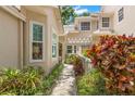 A beautifully landscaped walkway leads to the front entrance of this charming home at 5102 White Pine Ne Cir, St Petersburg, FL 33703