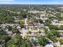 Aerial view of the property showcasing its location in a neighborhood with mature trees and nearby amenities at 6006 114Th N Ter, Pinellas Park, FL 33782
