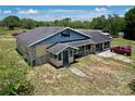 Charming single-story home with a screened porch and unique design details at 13341 Hexam Rd, Weeki Wachee, FL 34613