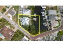 Aerial view displaying the property's boundaries with canal access, featuring a private dock and waterfront at 216 High St, Tarpon Springs, FL 34689