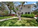 Beautifully landscaped front yard with a charming home and inviting walkway, perfect for outdoor enjoyment at 3011 Harbor View, Tampa, FL 33611