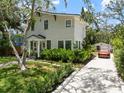 Charming home with well-maintained lawn, long driveway and lush landscaping creating great curb appeal at 3011 Harbor View, Tampa, FL 33611