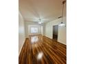 Spacious living room with plenty of natural light, crown moulding and hardwood flooring at 4207 S Dale Mabry Hwy # 9106, Tampa, FL 33611